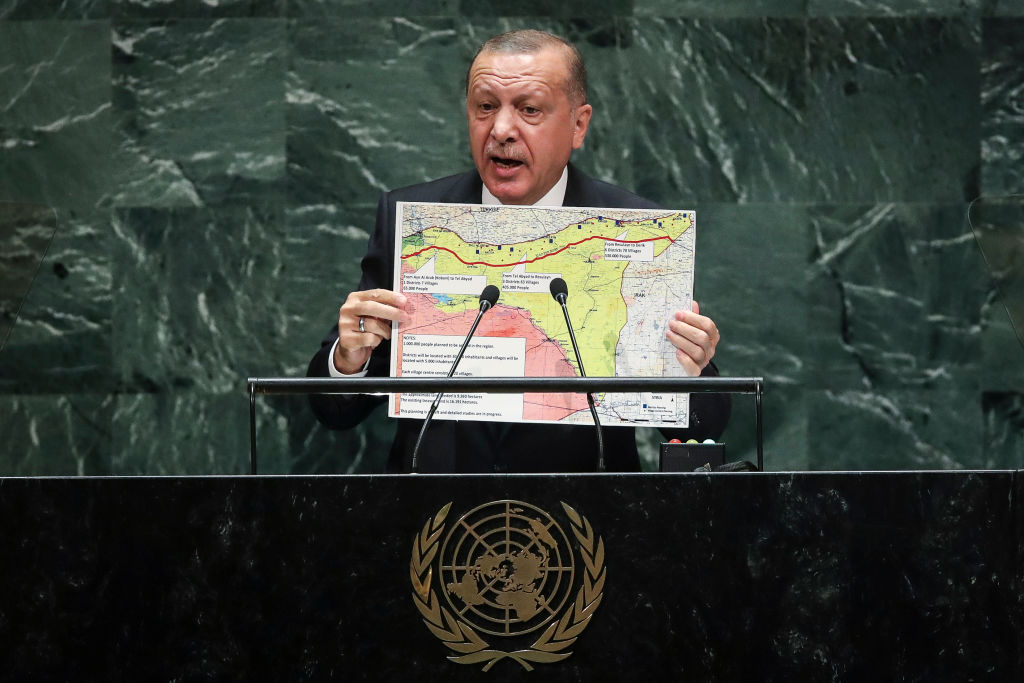 President of Turkey Recep Tayyip Erdogan holds up a map of the safe zone Turkey in in favor of while speaking to the United Nations General Assembly at UN headquarters on September 24, 2019 in New York City. 
