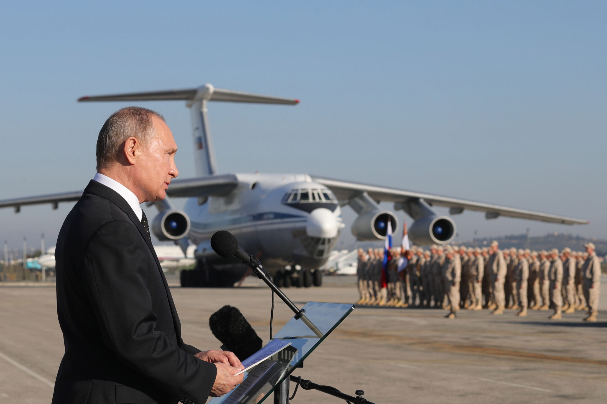 LATAKIA, SYRIA DECEMBER 11, 2017: Russia's President Vladimir Putin addresses Russian forces at the Russian Hmeimim air base. Putin has ordered Russian troops to start pulling out of Syria. Mikhail Klimentyev/Russian Presidential Press and Information Office/TASS (Photo by Mikhail KlimentyevTASS via Getty Images)