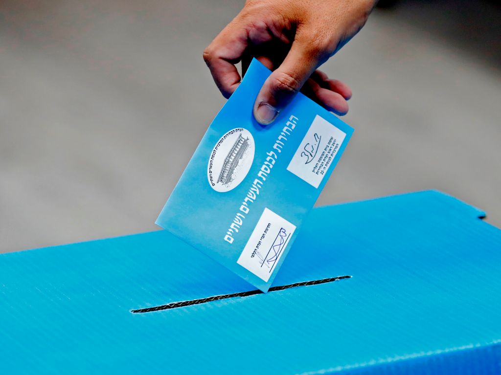 An Israeli man casts his ballot during Israel's parliamentary election, at a polling station in Rosh Haayin, on September 17, 2019.