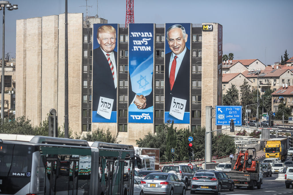 A general view of an election campaign banner depicting Israeli Prime Minister Benjamin Netanyahu (R), head of the Likud Party, shaking hands with US President Donald Trump, ahead of the snap Israeli legislative election, scheduled to take place on 17 September 2019