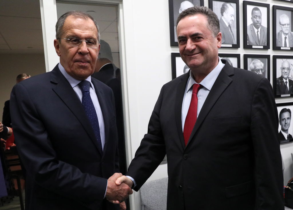 Russia's Foreign Minister Sergei Lavrov (L) and Israel's Foreign Minister Yisrael Katz shake hands during a meeting on the sidelines of the 74th session of the UN General Assembly at the headquarters of the United Nations in Manhattan. 