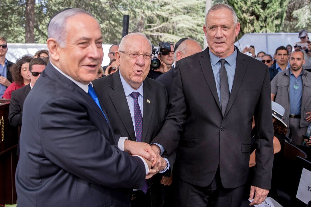 Israeli Prime Minister Benjamin Netanyahu (L), President Reuven Rivlin (C) and Benny Gantz, leader of Blue and White party, attend a memorial ceremony for late Israeli president Shimon Peres, at Mount Herzl in Jerusalem on September 19, 2019. 