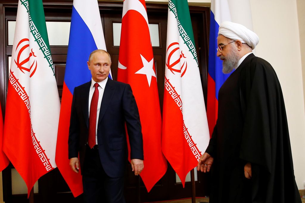 Russian President Vladimir Putin (L) and Iranian President Hassan Rouhani (R) attend the trilateral summit to discuss progress on Syria, between the Presidents of Turkey, Russia and Iran on November 22, 2017 in Sochi, Russia.