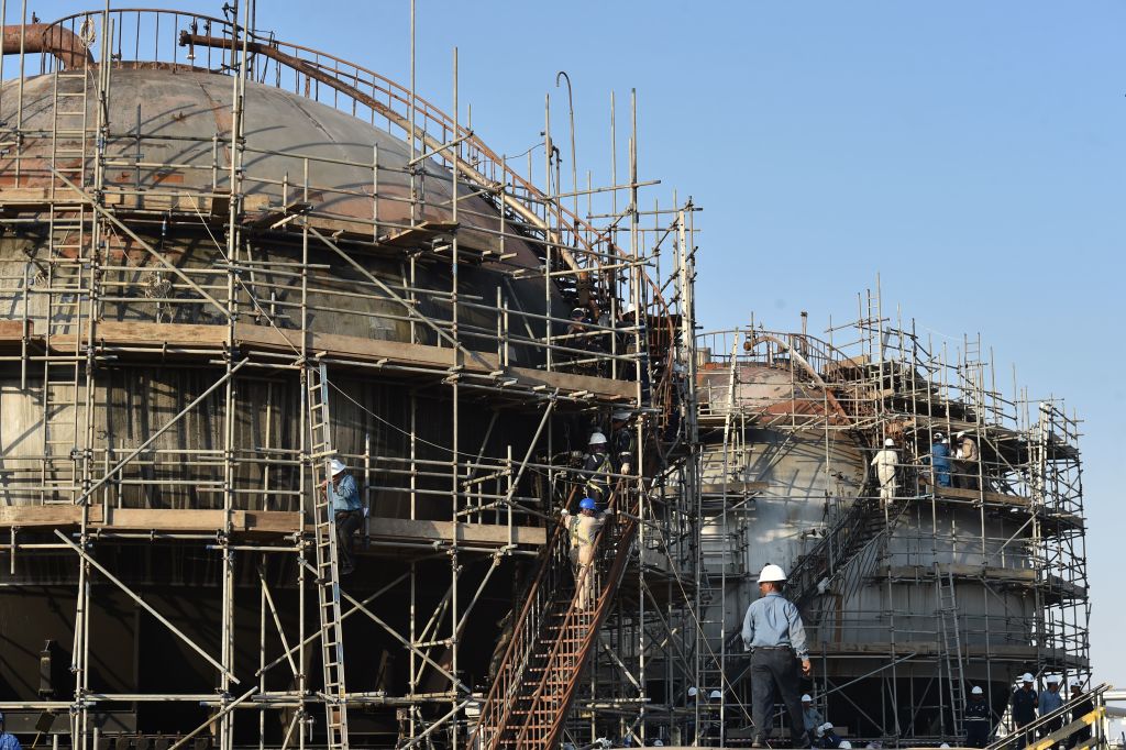 Employees of Aramco oil company work in Saudi Arabia's Abqaiq oil processing plant on September 20, 2019