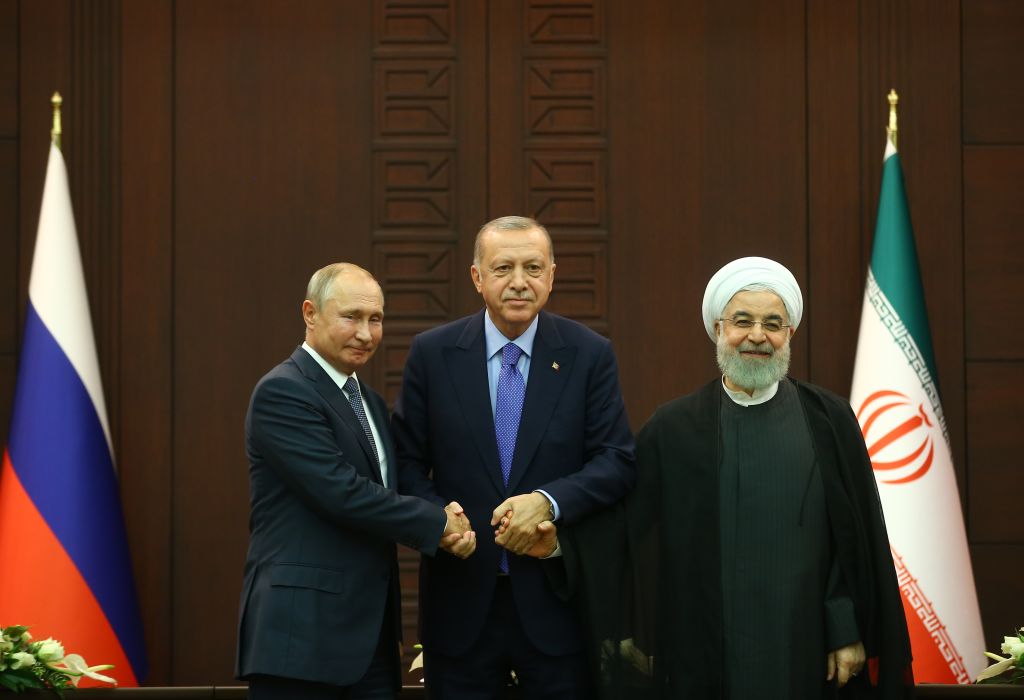  President of Turkey Recep Tayyip Erdogan (C), President of Russia Vladimir Putin (L) and President of Iran Hassan Rouhani (R) pose for a photo after the joint press conference held within the Turkey-Russia-Iran trilateral summit at Cankaya Mansion in Ankara, Turkey on September 16, 2019. 