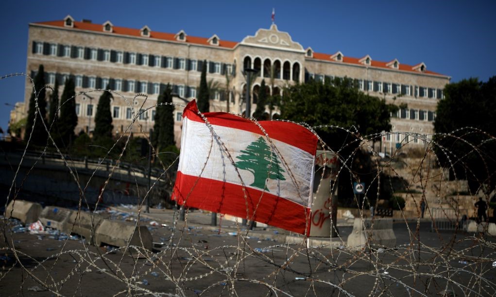 A Lebanese national flag fixed on barbed wire protecting the government headquarters, known as the Grand Serail, in central Beirut.