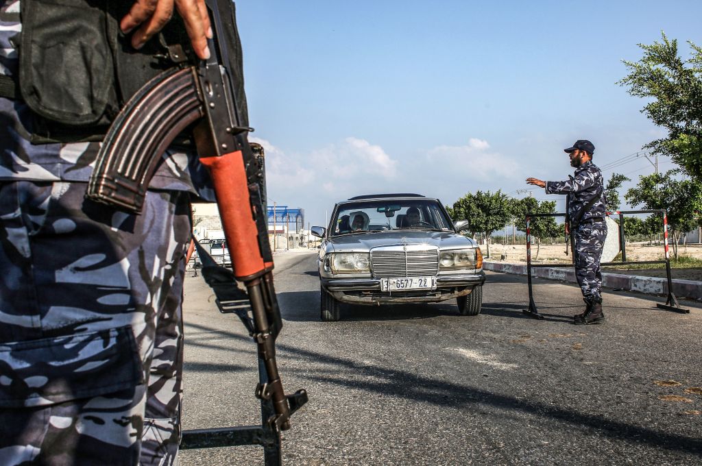 Security forces loyal to Palestinian Islamist movement Hamas stop a vehicle at a checkpoint in Khan Yunis in the southern Gaza Strip on August 28, 2019. 