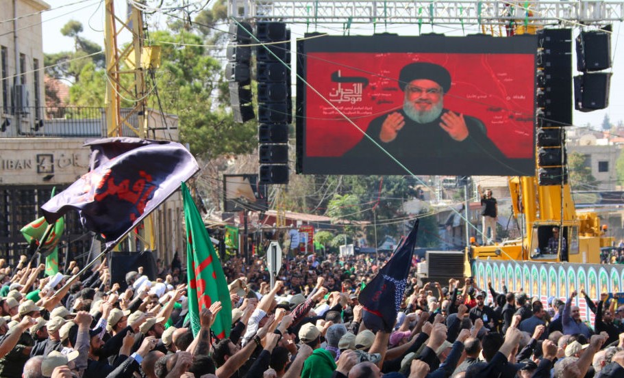 Shiite Muslims watch a televised speech by Hassan Nasrallah, the Lebanese Shiite Hezbollah movement leader, in the city of Baalbek in Lebanon's eastern Bekaa Valley on October 19, 2019.