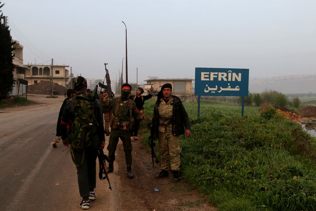 Free Syrian Army members are seen at the city center after Turkish Armed Forces and Free Syrian Army (FSA) on Sunday took complete control of northwestern Syria's Afrin within the 
