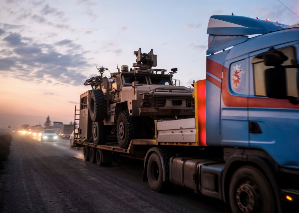 A convoy of U.S. armored military vehicles leave Syria on a road to Iraq on October 19, 2019 in Sheikhan, Iraq.