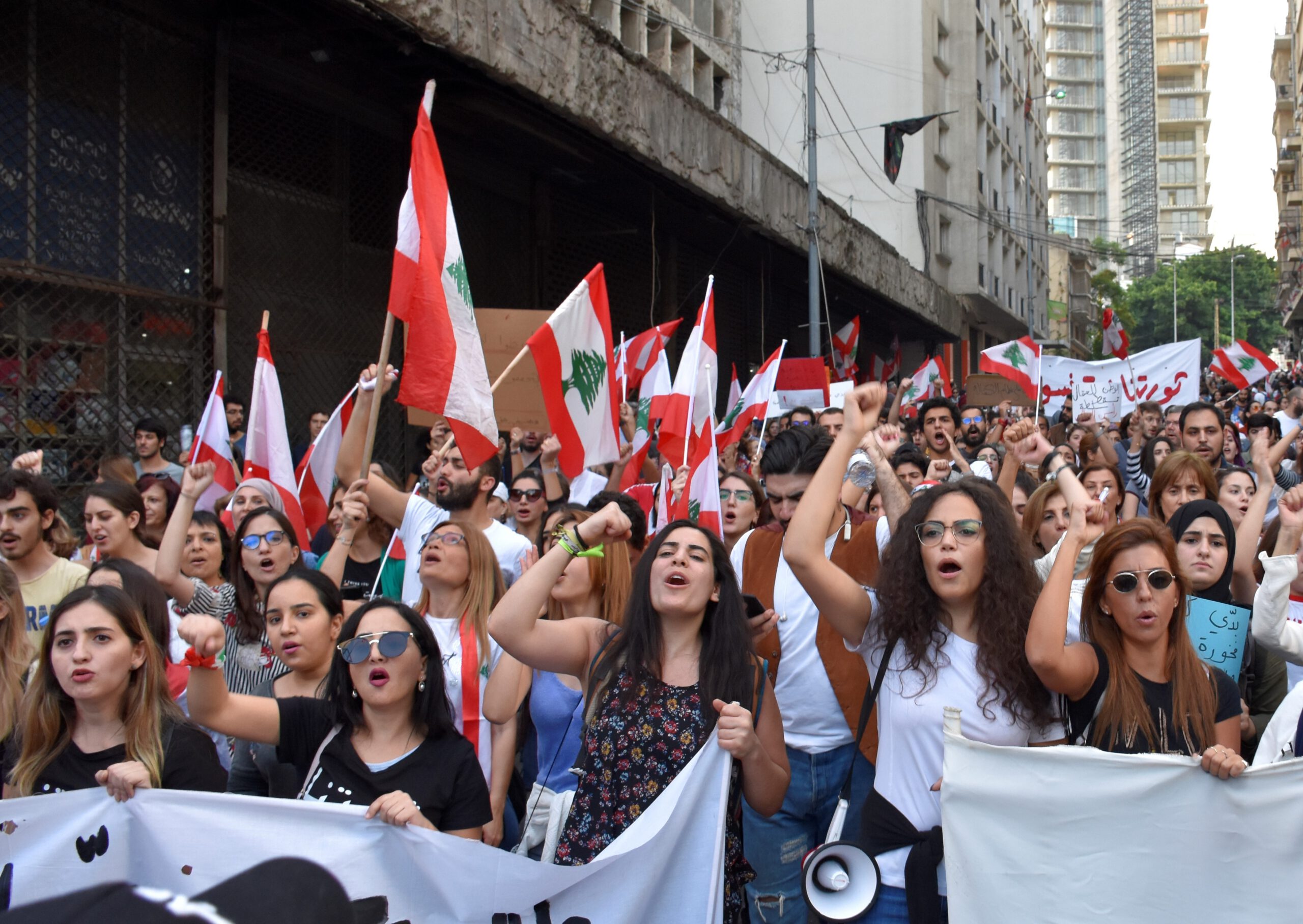 BEIRUT, LEBANON - NOVEMBER 03: People gather at Bechara El-Khoury Avenue to call protesters for them to continue the demonstrations until a new government formed as they march from Martyrs Square and Riyadh al-Solh Square in Beirut, Lebanon on November 03, 2019. (Photo by Mahmut Geldi/Anadolu Agency via Getty Images)