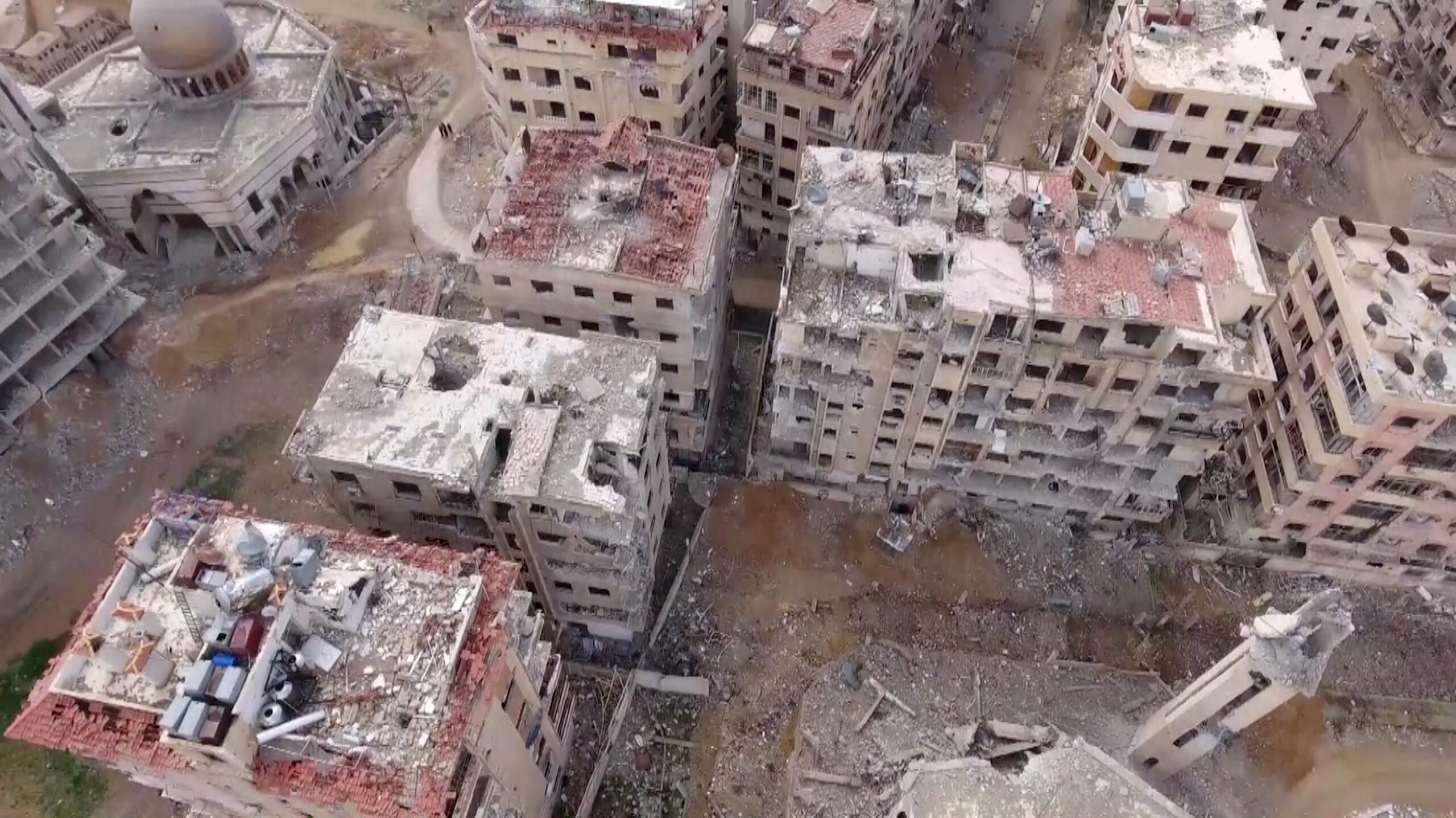 DAMASCUS, SYRIA - MARCH 01: A footage captured by an unmanned aerial vehicle shows wreckages of structures of Douma town, which has been under siege of Assad Regime, in Eastern Ghouta region, Damascus, Syria on March 01, 2018. (Photo by Stringer/Anadolu Agency/Getty Images)