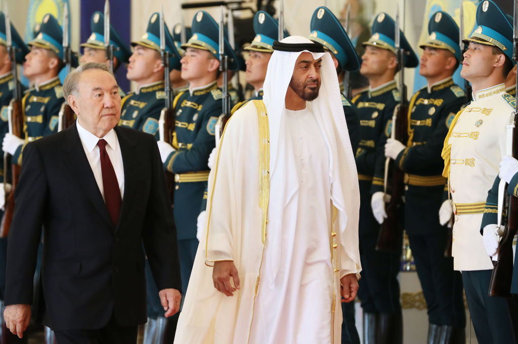 Abu Dhabi Crown Prince Mohammed bin Zayed al-Nahayan (R) reviews an honour guard with Kazakhstan's President Nursultan Nazarbayev during a welcoming ceremony in Astana on July 4, 2018.