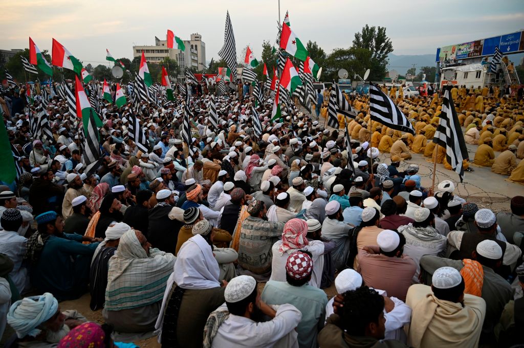 Activists and supporters of Islamic political party Jamiat Ulema-e-Islam (JUI-F) attend an anti-government 