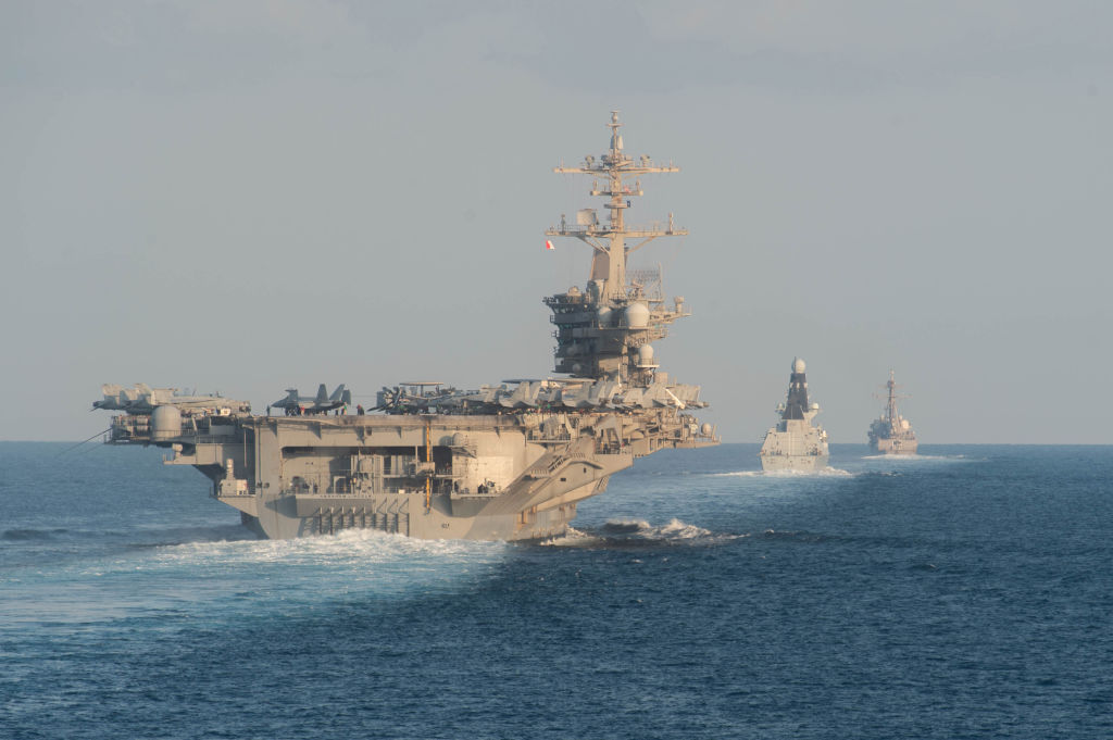 The aircraft carrier USS Abraham Lincoln (CVN 72), left, the Royal Navy air defense destroyer HMS Defender (D 36) and the guided-missile destroyer USS Farragut (DDG 99) transit the Strait of Hormuz on November 19, 2019.