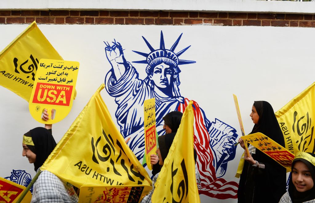  People gather in front of the former US Embassy building to stage a protest against United States due to the 40th anniversary of the occupation of former US Embassy building in Tehran, Iran on November 04, 2019.