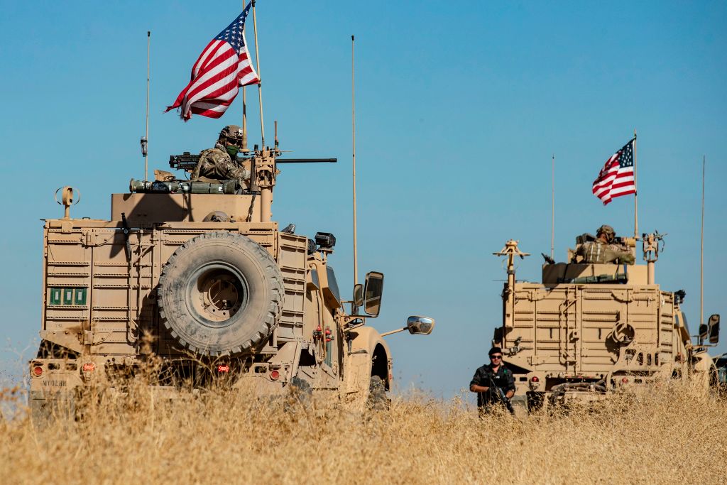 A convoy of US military vehicles drives near the town of Tal Tamr in the northeastern Syrian Hasakeh province on the border with Turkey, on November 10, 2019.