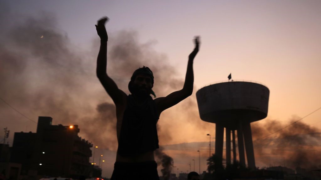 An Iraqi protester chants slogans during a demonstration against state corruption, failing public services and unemployment at Tayaran square in Baghdad on October 2, 2019.
