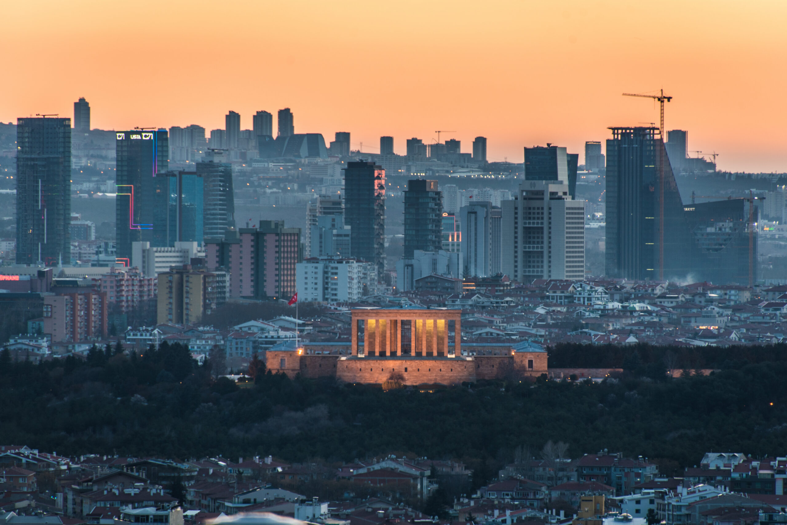 The sunset casts an orange sky over the new urban skyline of Turkey's capital city, Ankara, which is centered around the Anitkabir, the memorial tomb of the country's founding father Mustafa Kemal Ataturk.
