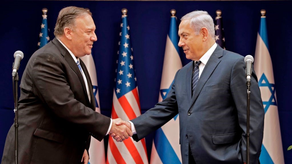 Israeli Prime Minister Benjamin Netanyahu (R) shakes the hand of US Secretary of State Mike Pompeo following their meeting in Jerusalem on October 18, 2019. 
