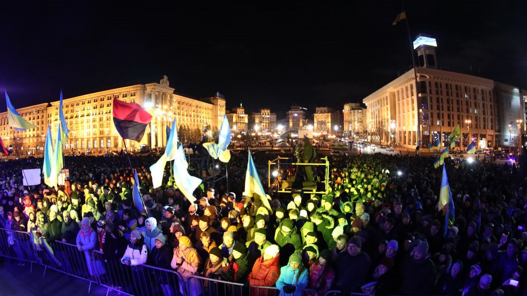 People attend a rally marking the 6th anniversary of the 2014 Euromaidan antigovernment riots at Kiev's Independence Square.