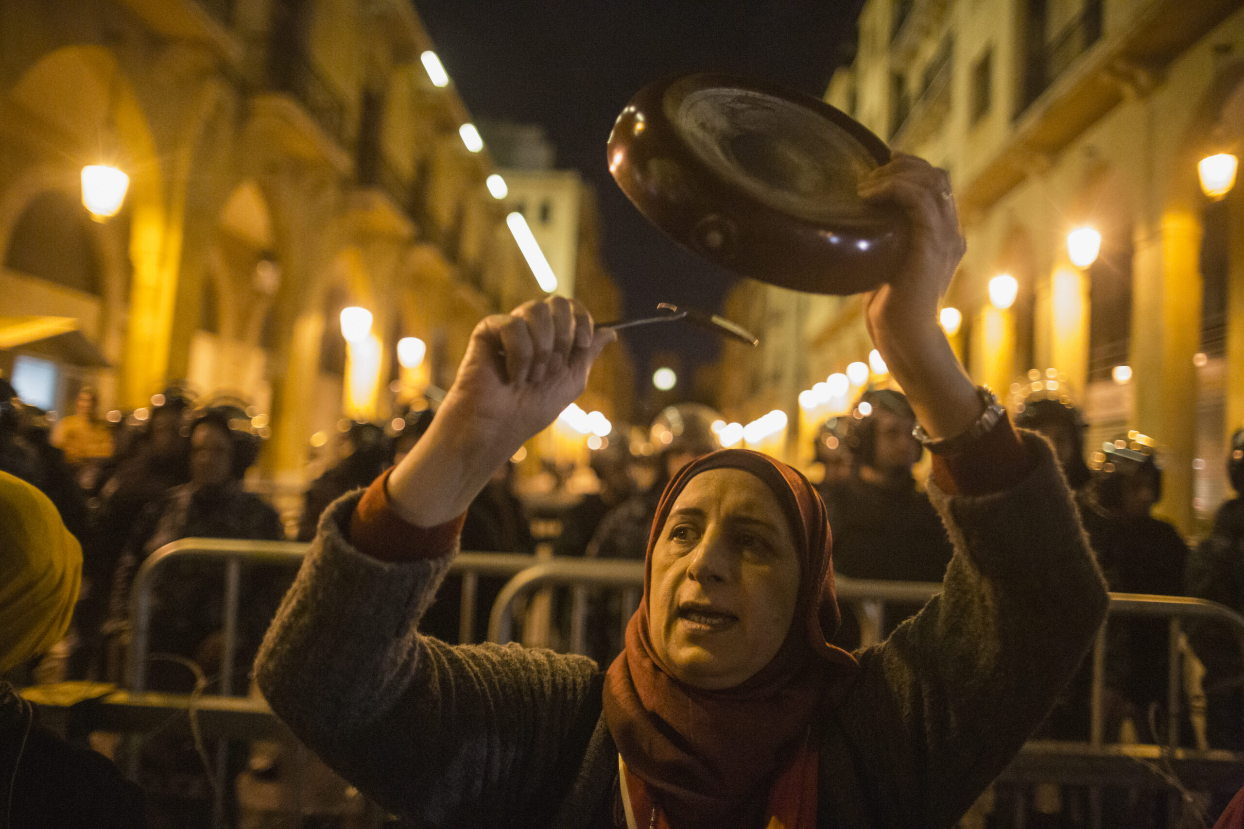 BEIRUT, LEBANON - JANUARY 16: An anti-government protester bangs a pan as they demonstrate ahead of the expected naming of a new cabinet tomorrow by Prime Minister Designate Hassan Diab, on January 16, 2020 in Beirut, Lebanon. 