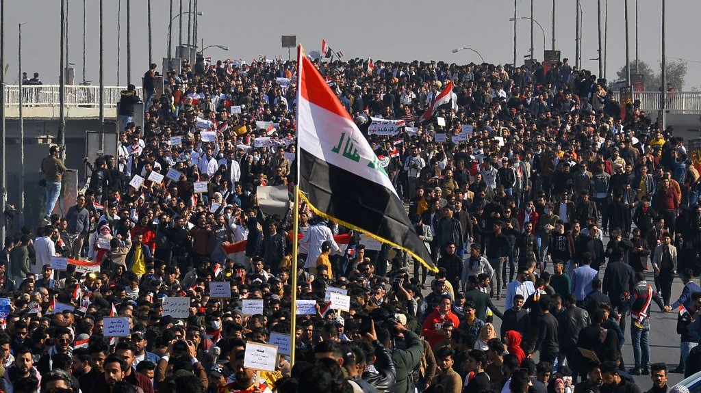 Iraqi students, waving national flags, join anti-government protests in the Shiite shrine city of Najaf in central Iraq on January 28, 2020.