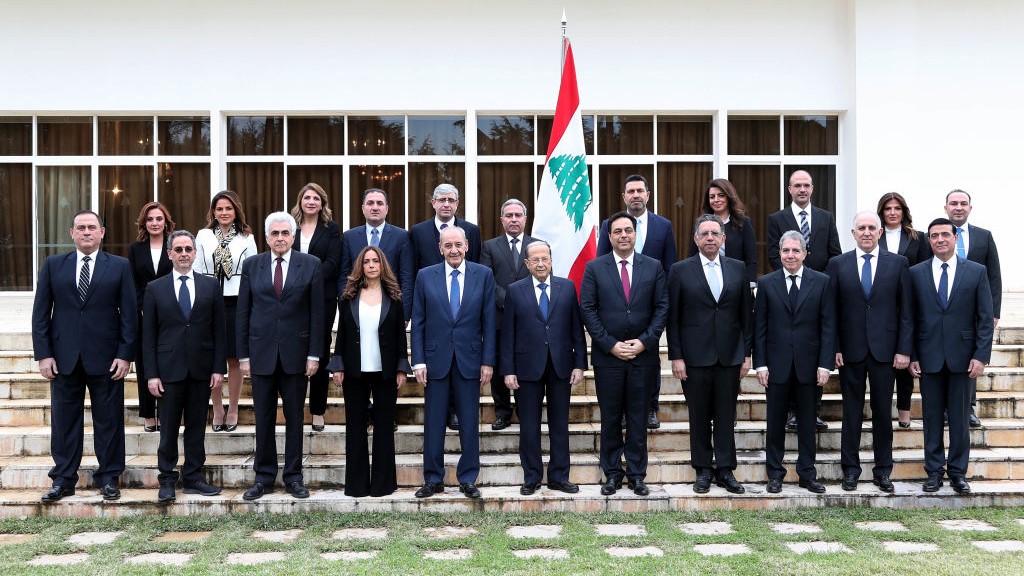 A handout picture provided by the Lebanese photo agency Dalati and Nohra shows Lebanon's Parliament Speaker Nabih Berri (C-L) and President Michel Aoun (C) and prime minister designate Hassan Diab (C-R) posing for a group photo with the newly formed government at the presidential palace in Baabda, east of the capital Beirut, on January 22, 2020.