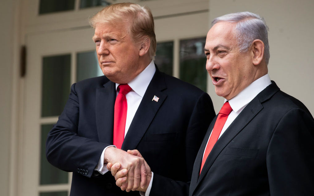 U.S. President Donald Trump and Prime Minister of Israel Benjamin Netanyahu shake hands while walking through the colonnade prior to an Oval Office meeting at the White House March 25, 2019 in Washington, DC. 
