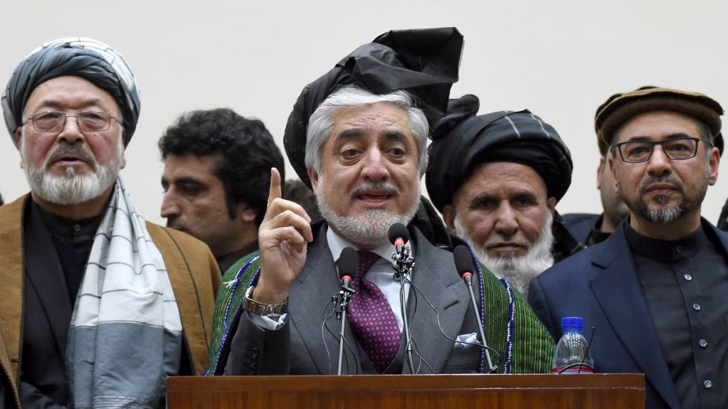 Afghan presidential election opposition candidate Abdullah Abdullah (C) gestures as he takes part in a press conference after the announcement of the final presidential elections results at the Sapedar Palace in Kabul on February 18, 2020. 