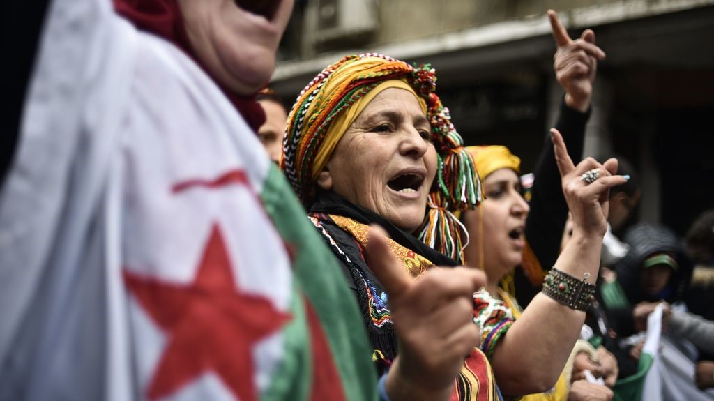 Algerians chant slogans as they take part in an anti-government demonstration in the center of the capital Algiers on January 10, 2020. 