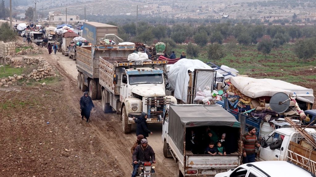 Syrian families, who have been forced to displace due to the ongoing attacks carried out by Assad regime and Russia, are seen on their way to safer zones with their belongings, at Atme camps in Idlib, Syria on January 19, 2020. 