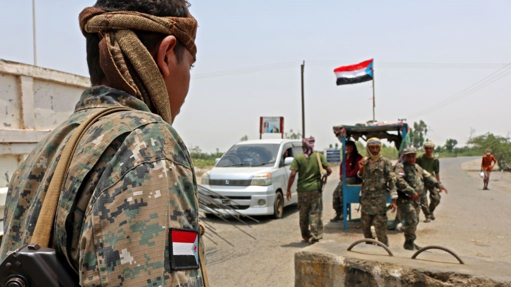 Fighters with the UAE-trained Security Belt Forces loyal to the pro-independence Southern Transitional Council (STC) man a checkpoint near the south-central coastal city of Zinjibar in south-central Yemen, in the Abyan Governorate, on August 21, 2019. 
