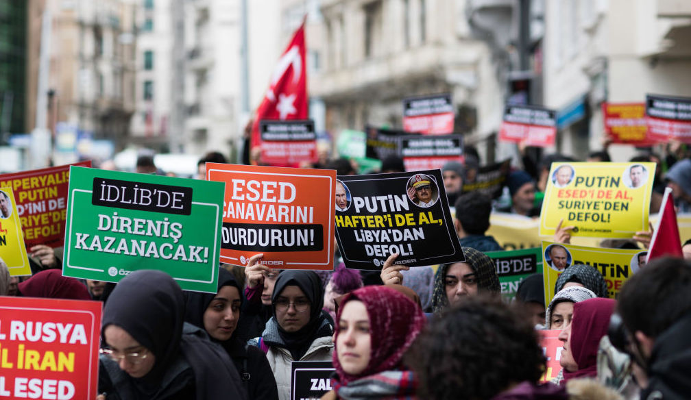 Women in Istanbul hold banners which read murderer Russia, murderer Iran, murderer Esed during the protest on February 29, 2020 after 33 Turkish soldiers were killed in Idlib, Syria on 27 February.