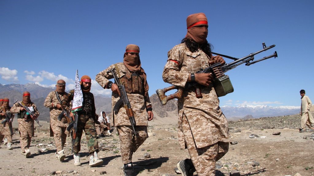 Afghan Taliban fighters and villagers attend a gathering as they celebrate the peace deal signed between US and Taliban in Laghman Province, Alingar district on March 2, 2020. 