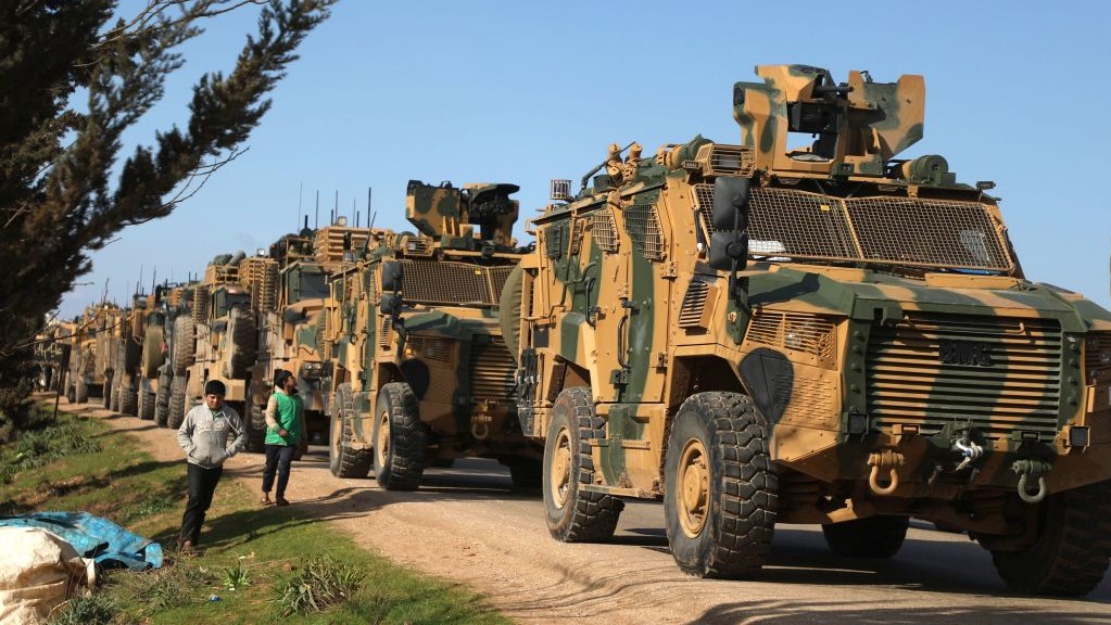 A Turkish military convoy is seen parked near the town of Batabu on the highway linking Idlib to the Syrian Bab al-Hawa border crossing with Turkey, on March 2, 2020. 