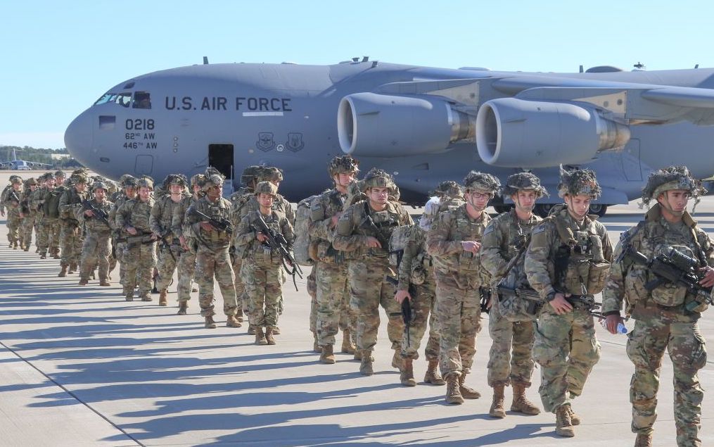 U.S. Army Paratroopers assigned to the 2nd Battalion, 504th Parachute Infantry Regiment, 1st Brigade Combat Team, 82nd Airborne Division, deploy from Pope Army Airfield, North Carolina on January 1, 2020. 