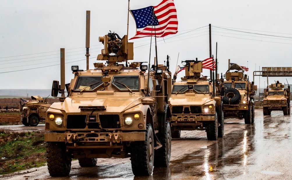 American soldiers patrol on the M4 highway in the town of Tal Tamr in the northeastern Syrian Hasakeh province on the border with Turkey on January 24, 2020. 