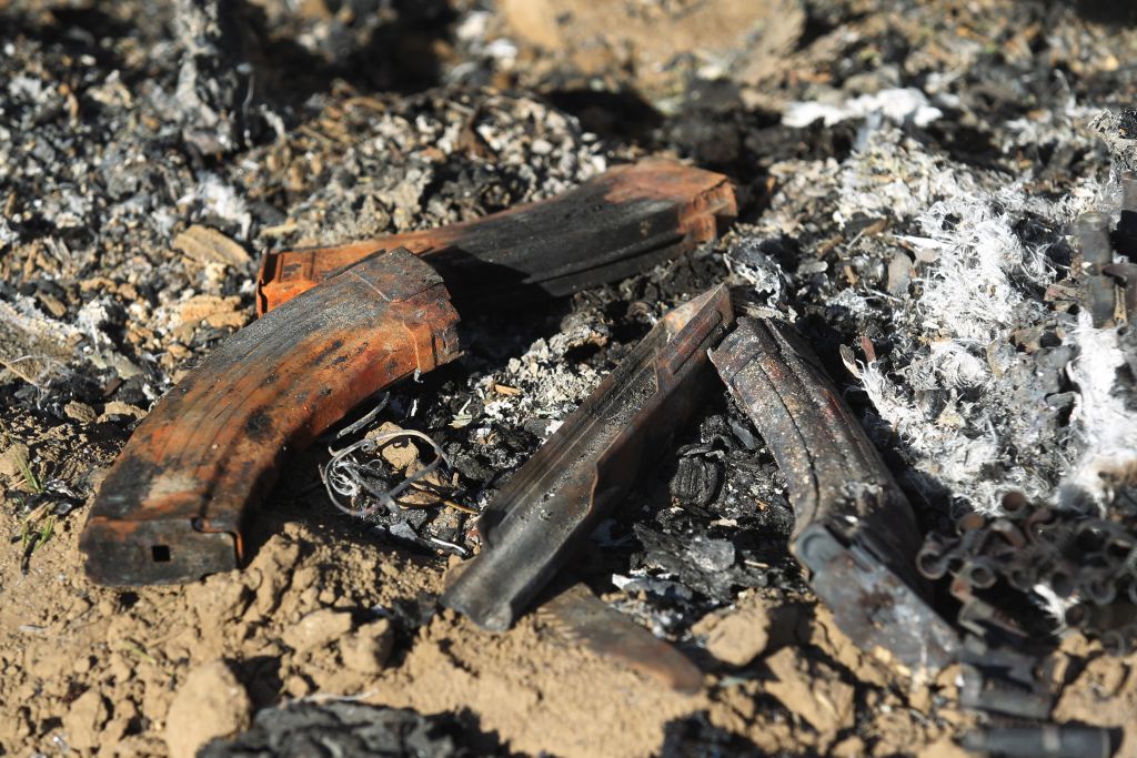 Damaged military gear is scattered on the ground at the site of an Islamic State (IS) group attack, a day earlier, on a unit of Iraq's Hashed al-Shaabi (Popular Mobilisation Forces) in Mukaishefah, about 180km (110 miles) north of the capital, on May 3, 2020. 