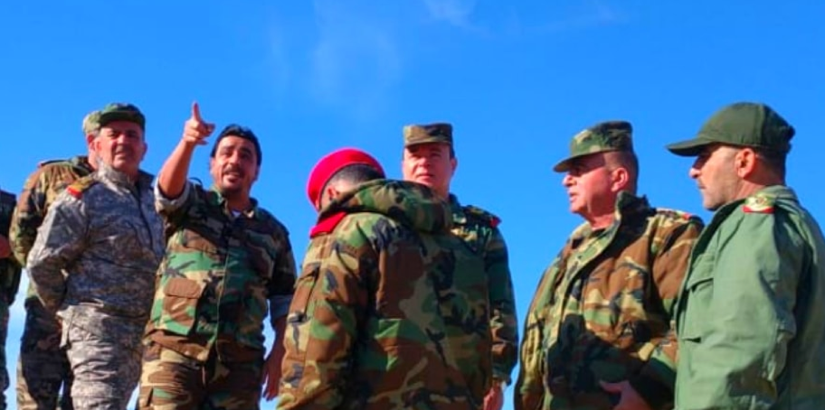 Maj. Gen. Khader (center) tours regime positions near Shoula alongside Feras Jeham (pointing) commander of the Deir ez-Zor NDF and Republican Guard officers.