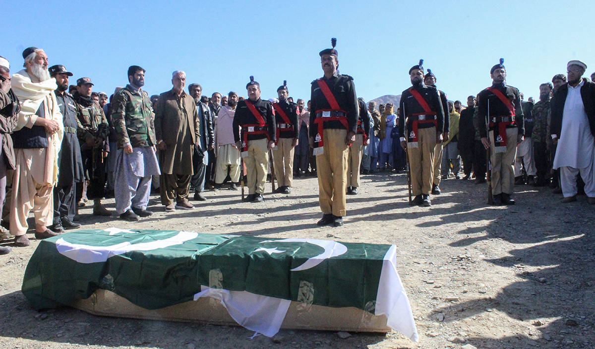 Security officials and relatives attend a funeral ceremony of a slain policeman, who was killed in an attack claimed by the Tehreek-e-Taliban Pakistan (TTP), in the border town of Chaman on January 28, 2022. (Photo by Abdul BASIT / AFP) (Photo by ABDUL BASIT/AFP via Getty Images)