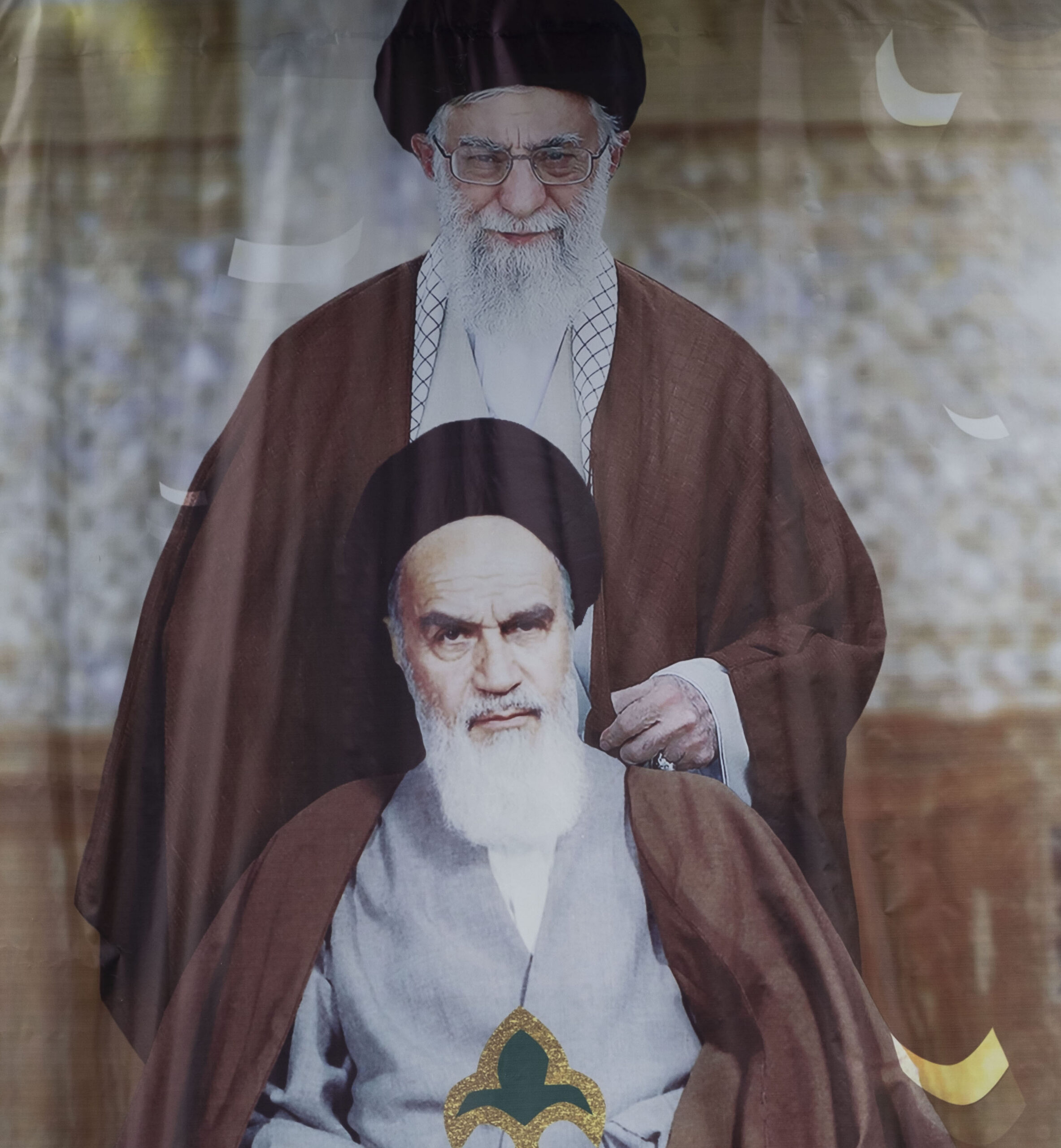 Photo above: Two Islamic Revolutionary Guard Corps (IRGC) military personnel stand under portraits of Iran’s Supreme Leader Ayatollah Ali Khamenei (top) and late leader Ayatollah Ruhollah Khomeini on Azadi Avenue in west Tehran during a rally to mark 43rd anniversary of Iran’s 1979 Islamic Revolution. Photo by Morteza Nikoubazl/NurPhoto via Getty Images.