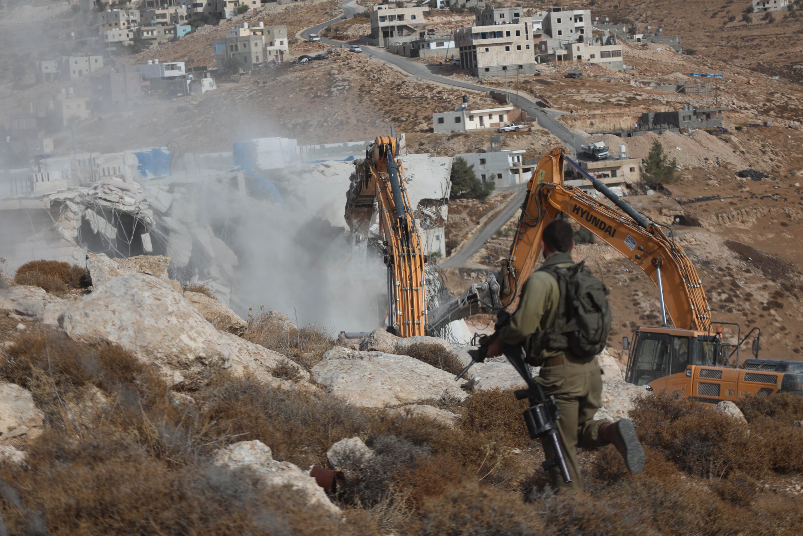 MIDEAST-HEBRON-HOUSE-DEMOLITION Israeli bulldozers demolish a Palestinian house, which is believed to have been built without permit, in Bani Naim town near the West Bank city of Hebron, Oct. 25, 2022. (Photo by Mamoun Wazwaz/Xinhua via Getty Images)