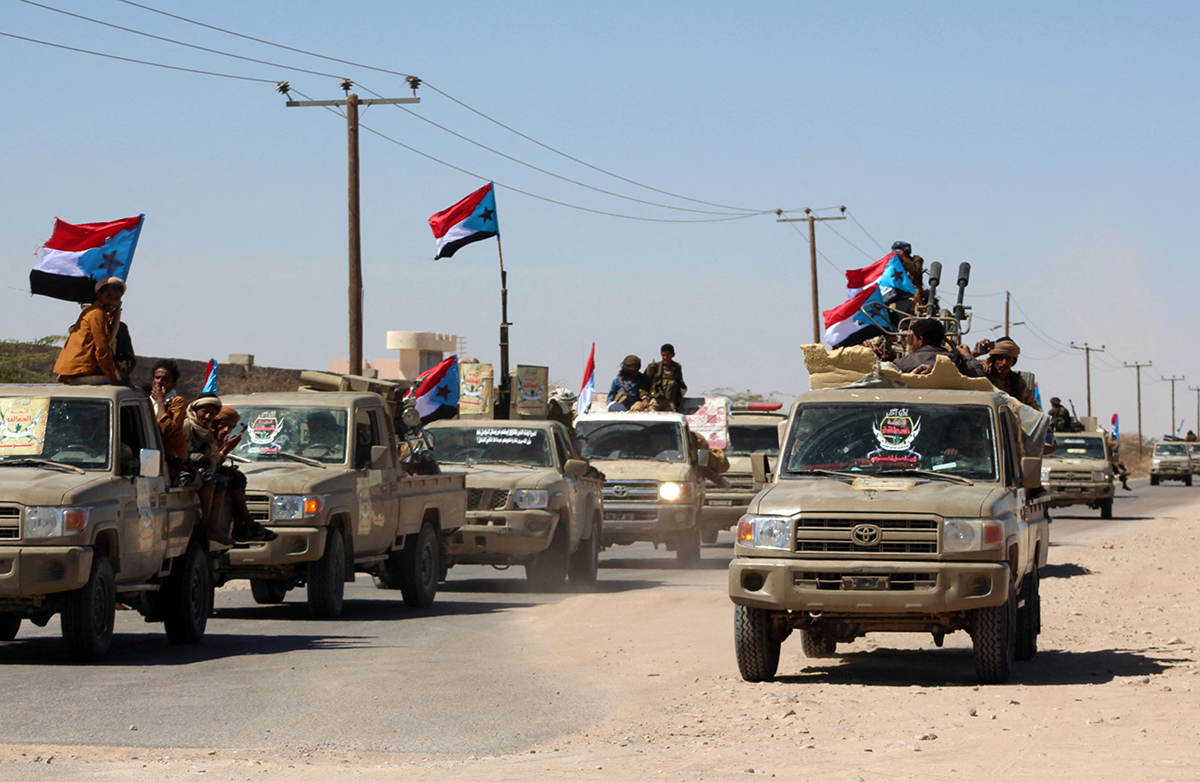 Yemeni pro-government fighters from the UAE-trained Giants Brigade gather on the outskirts of Ataq city, east of the Red Sea port of Aden, on their way to the frontline to face the Houthis on Jan. 28, 2022. Photo by SALEH AL-OBEIDI/AFP via Getty Images.