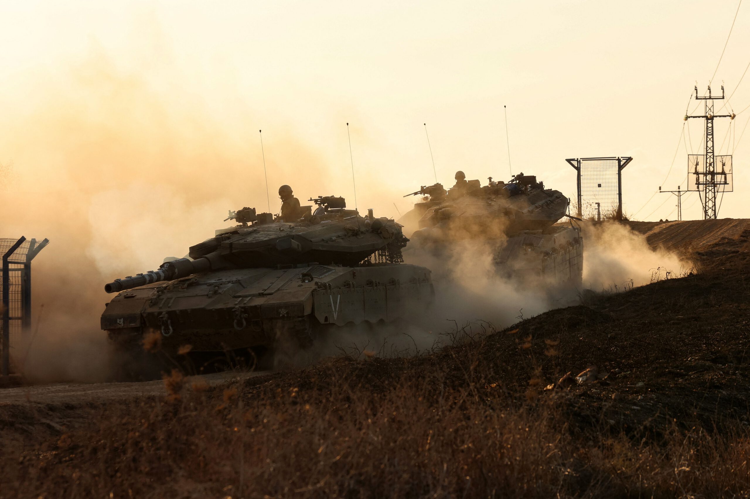 Photo above: Israeli tanks move in an undisclosed location along the border with the Gaza Strip on Oct. 18, 2023. Photo by GIL COHEN MAGEN/AFP via Getty Images.
