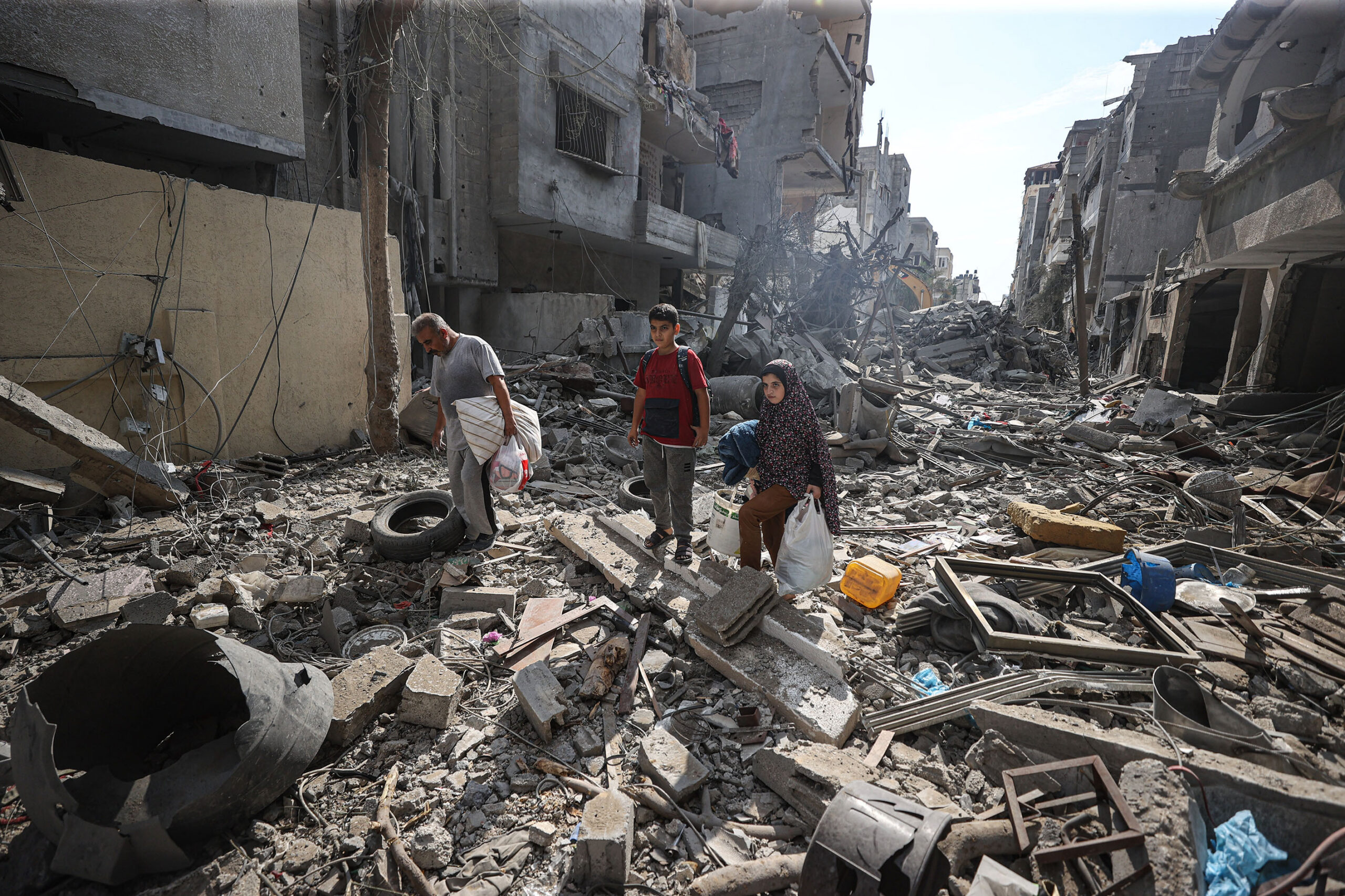 Photo above: Palestinians look for their belongings among the rubble of their destroyed houses on Oct. 16, 2023, in the aftermath of Israeli attacks on Gaza City, Gaza. Photo by Mustafa Hassona/Anadolu via Getty Images.