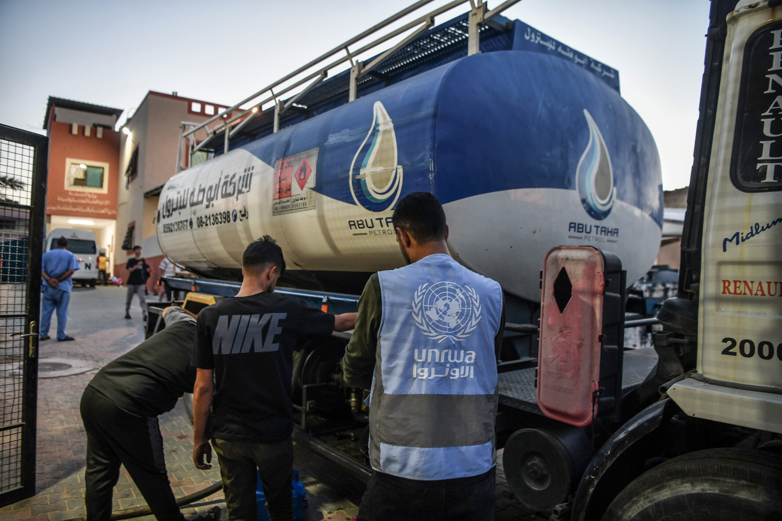 Photo above: Officials of the United Nations Relief and Works Agency for Palestine Refugees in the Near East (UNRWA) bring fuel to Al-Nasr Hospital in Khan Yunis, Gaza, on Nov. 10, 2023. Photo by Abed Zagout/Anadolu via Getty Images.