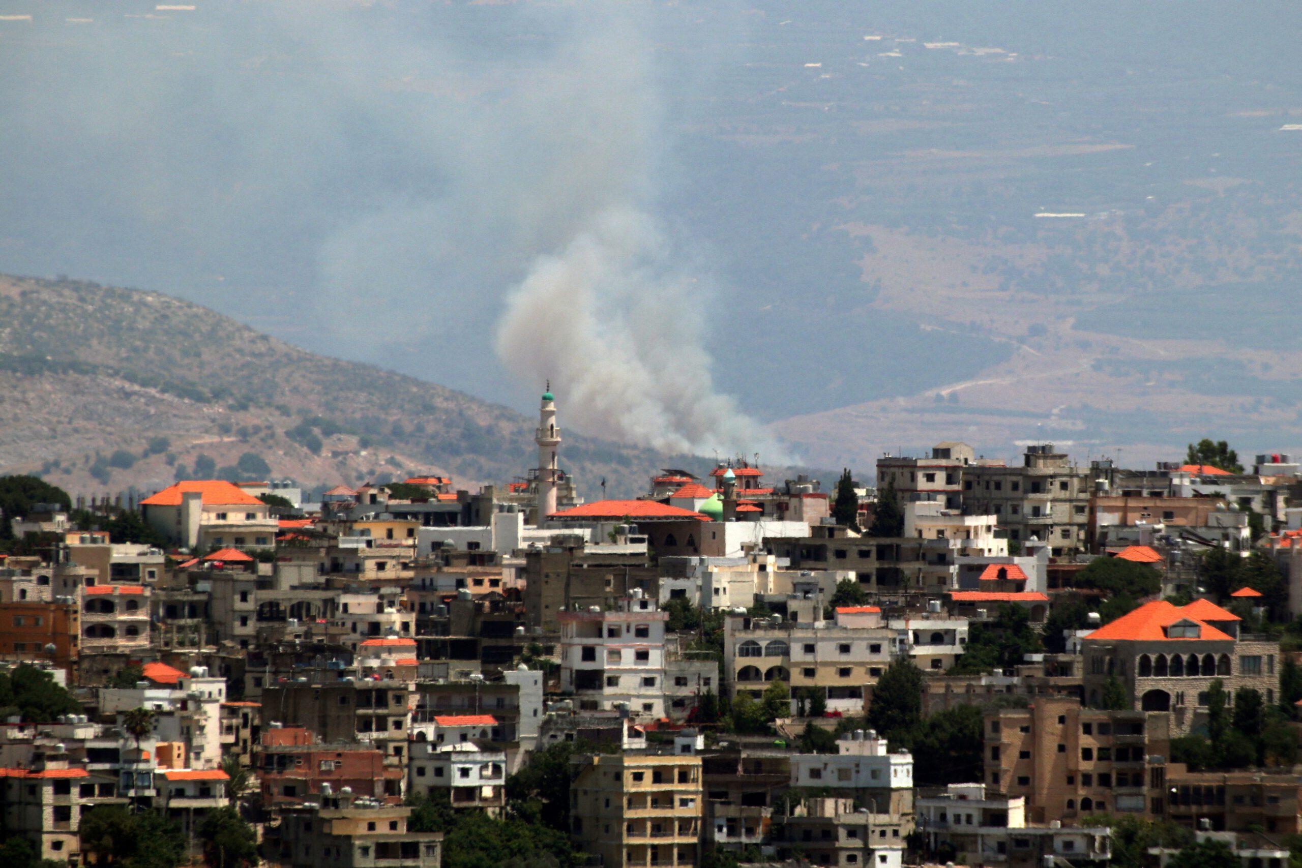 Photo above: Plumes of smoke rising from an area targeted by rockets on June 21, 2024, amid ongoing cross-border clashes between Israel and Hezbollah. Photo by RABIH DAHER/AFP via Getty Images.
