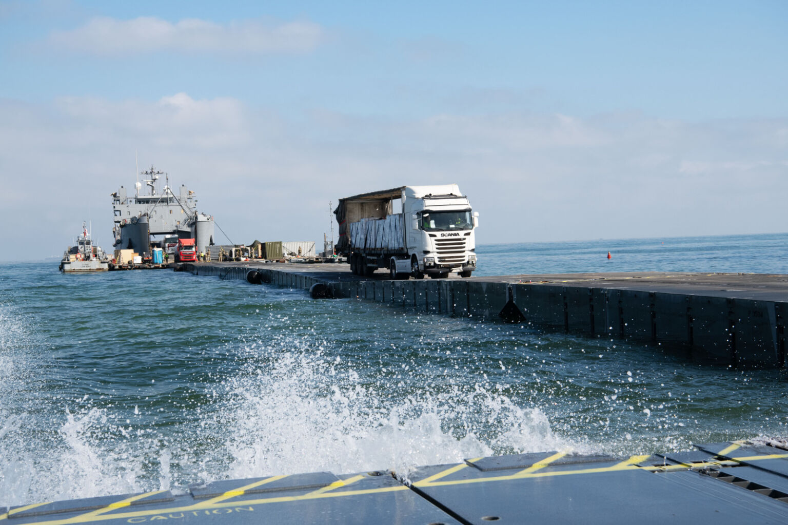 Photo above: Humanitarian aid reaches Gaza via the temporary Trident Pier, June 11, 2024. Photo by Navy Petty Officer 1st Class Jordan Kirk Johnson.