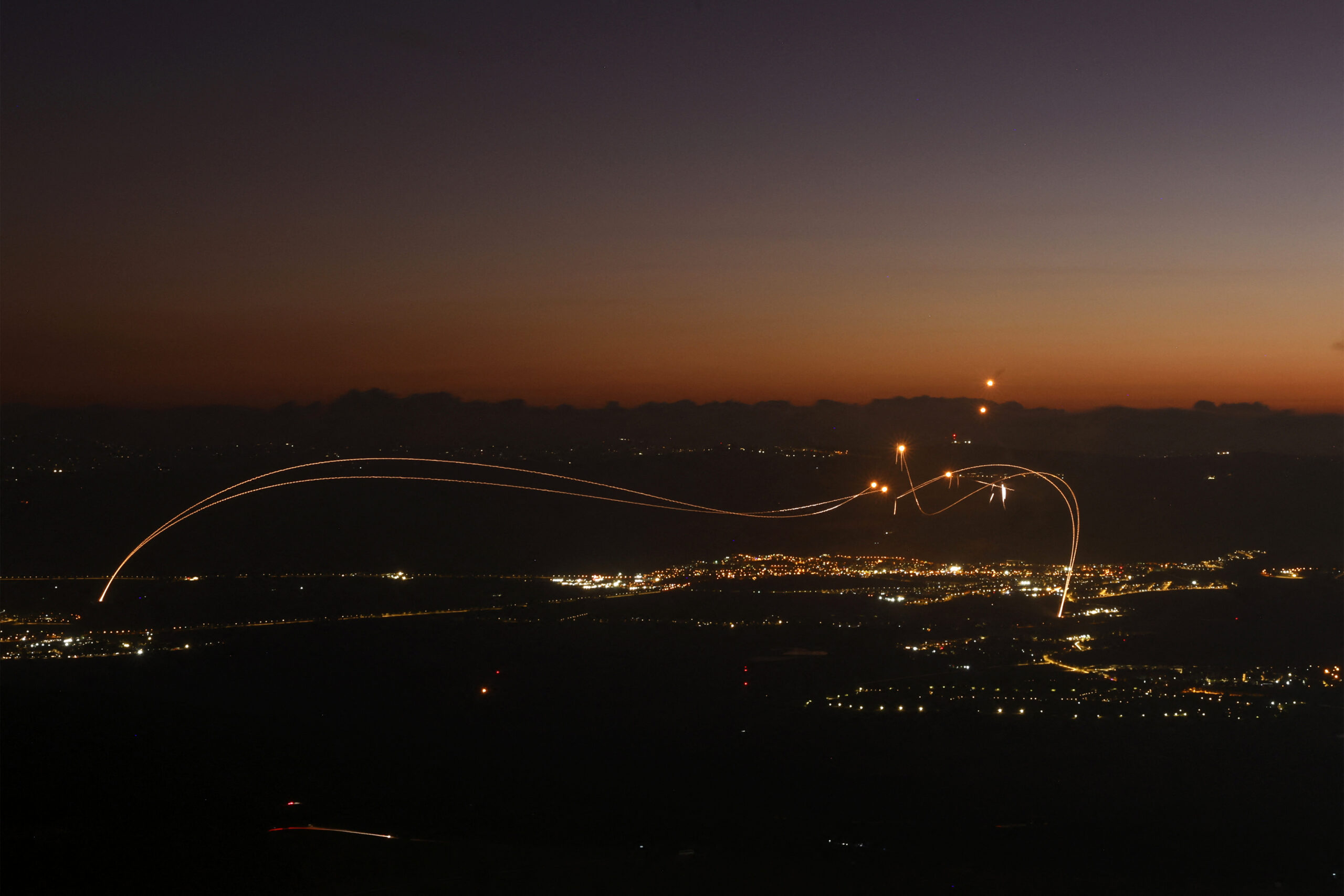 Photo above: Rockets fired from southern Lebanon are intercepted by Israel’s Iron Dome air-defense system over the Upper Galilee region in northern Israel on Aug. 23, 2024. Photo by JALAA MAREY/AFP via Getty Images.